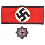 A Third Reich SS cloth arm band, with sewn in cloth labels bearing RZM and SS symbols and marked “