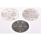 Three Third Reich dog tags: aluminium, stamped “1723 St Ammb/H.F.L. A.E.u.A.A.277”, and “1519 13/