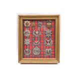 An attractively mounted framed display of 13 Scottish badges, on tartan backing: Ryl Scots, Ryl.