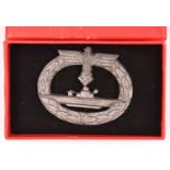 A Third Reich U boat badge, of grey metal with sharp details, the reverse with maker’s initials “R.
