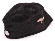 Third Reich SS mans field cap, black cloth with alloy Death’s Head button and embroidered eagle, (