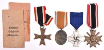 Third Reich medals: Faithful Service Decoration 2nd class; War Merit Cross 2nd class with swords,