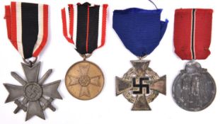 Third Reich medals: War Merit Cross 2nd class with swords, of grey metal, the ring stamped “74”; War