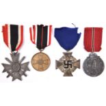 Third Reich medals: War Merit Cross 2nd class with swords, of grey metal, the ring stamped “74”; War