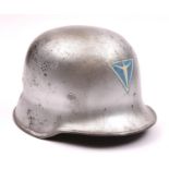 A German WWII Junkers aircraft factory guards’ police type steel helmet, painted silver with Junkers