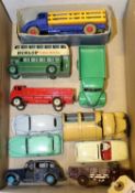 10 Dinky Toys. Leyland Comet Stake Truck in dark blue and yellow, with red wheels. Plus a Bedford