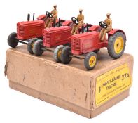 A Dinky Toys Trade Box (27A). Containing 3 Massey-Harris Tractors. In red with yellow wheels and