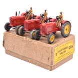 A Dinky Toys Trade Box (27A). Containing 3 Massey-Harris Tractors. In red with yellow wheels and