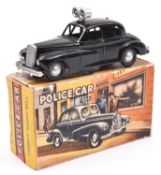 A Modern Product (Morestone) Wolseley Police Car. In gloss black with loud speakers to roof and bell