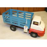 A Tri-ang Ford Thames Trader Farm Produce Lorry. Red and white cab, red chassis and blue body. GC,