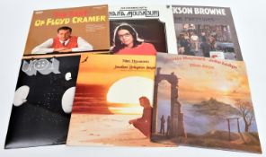 60+ 12" vinyl records of mainly 1960s/70s/80s mainstream rock and pop including: Dire Straits,
