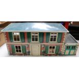 A Mettoy Playthings Metal (tinplate) Dolls House & Garage (6255). A very good example of this