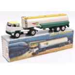 A French Dinky Supertoys Tracteur Unic Avec Semi-Remorque 'Air BP'. In white, yellow & green with