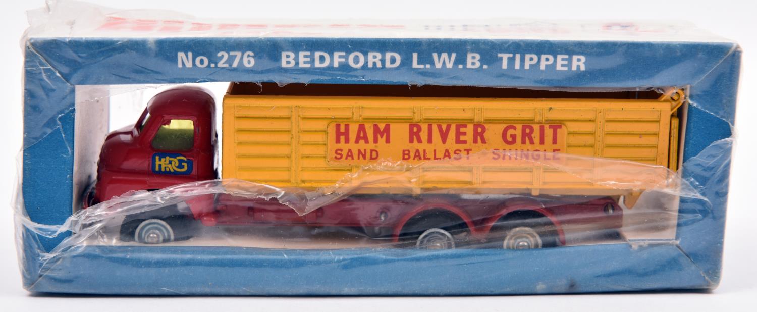 A Budgie Bedford L.W.B. Tipper No.278. Vehicle in red with yellow rear body, 'Ham River Grit'