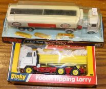 2 Dinky Toys Trucks. Foden Tipping Lorry (432). White cab, red chassis, with yellow body and wheels.