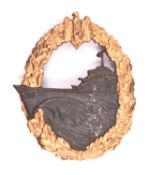 A Third Reich Destroyer badge, gold washed wreath, grey ship, marked on reverse "S.H.U. Co" (