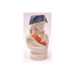 An old glazed earthenware "character" jug in the form of Admiral Nelson, wearing medals and