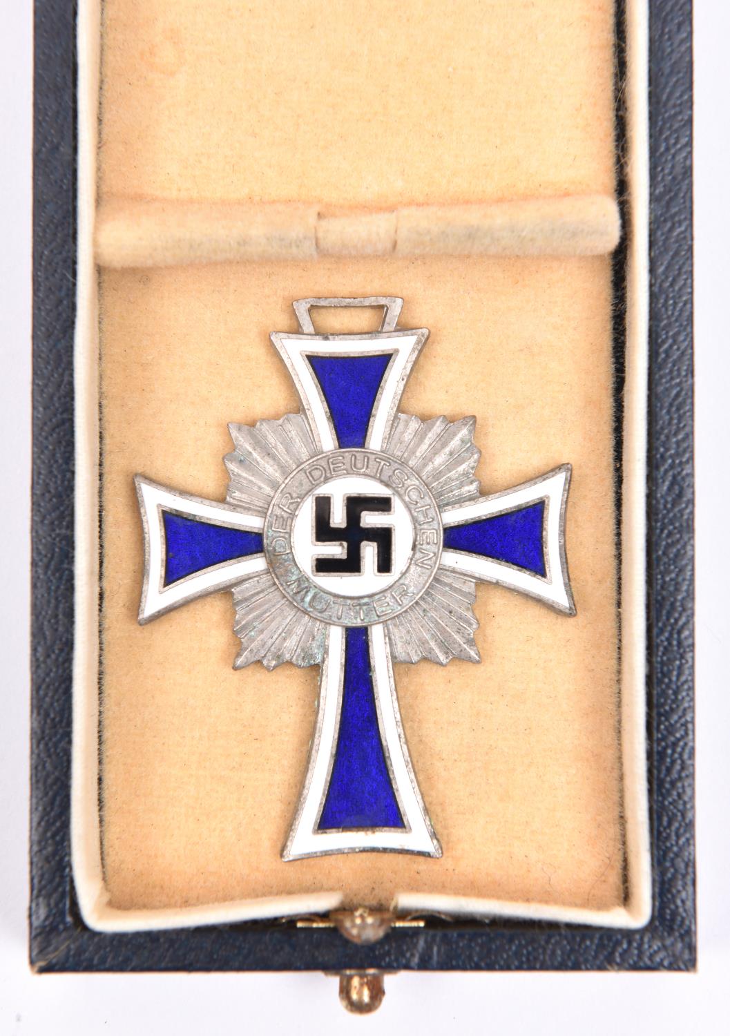 A Third Reich Deutsche Mutter Kreuz, silvered and enamelled, in its case of issue. GC £30-35