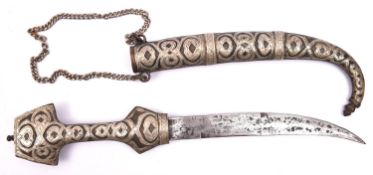 A Moroccan tourist quality jambiya, blade 8" (very worn), with white metal overlaid brass hilt and