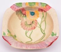 A Clarice Cliff bowl. Stamped for Newport Pottery, England. Overstamped with Wilkinson, England.