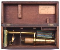 A late 19th Century/early 20th Century microscope. With alternative lens and 10x sides. In fitted