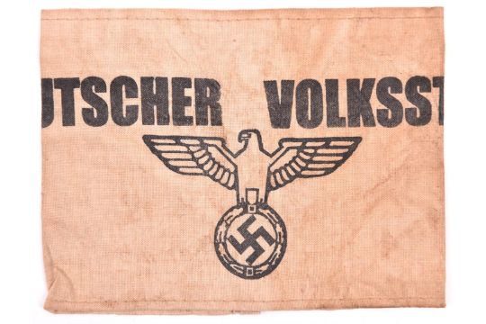 A Third Reich Volksturm armband, cream coloured fabric and printed in black with ?Deutscher