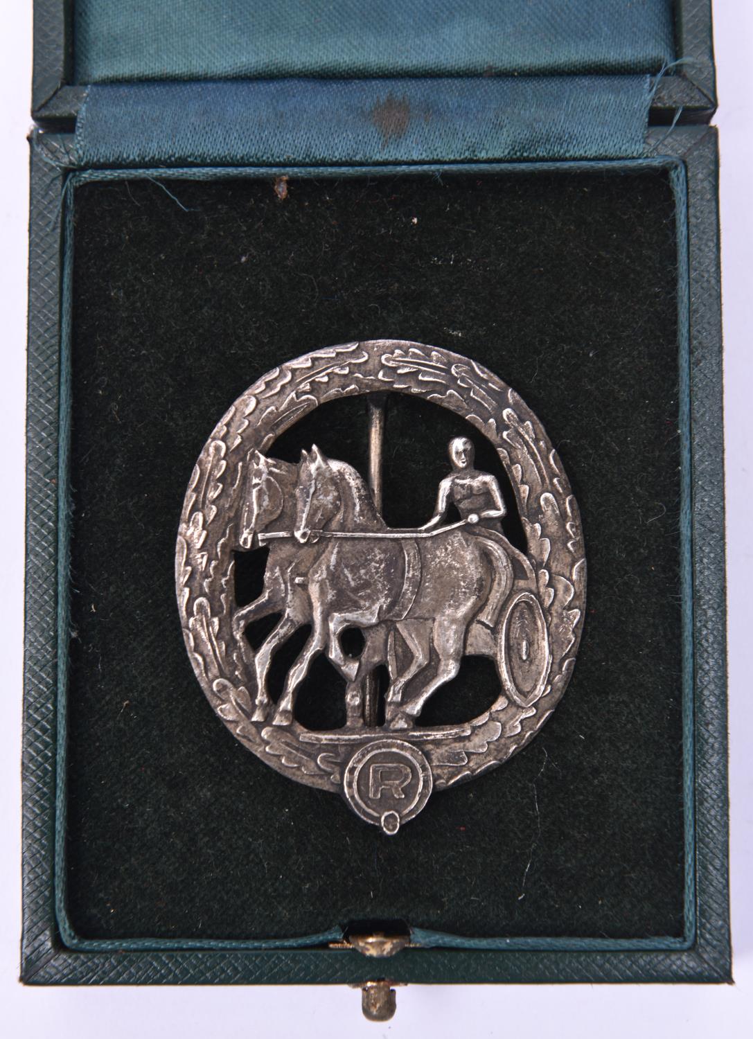 A Third Reich German Horse drivers badge in silver, in case of issue. VGC £100-140