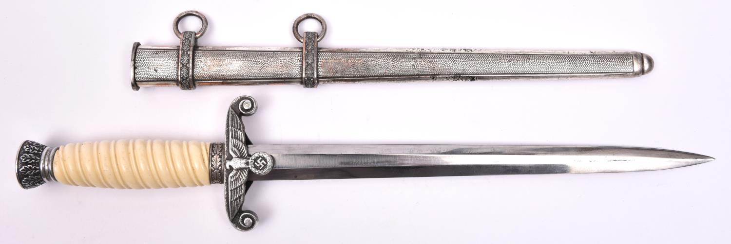 A Third Reich Army officer's dagger, with unmarked blade, aluminium crosspiece and pommel, and white