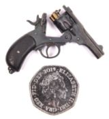 A well detailed miniature model of a Webley Mark V revolver, 2" overall, fixed in the open