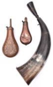 A small plain copper powder flask, 5¾", FC (very dented); a cowhorn flask with drinking cup plug,