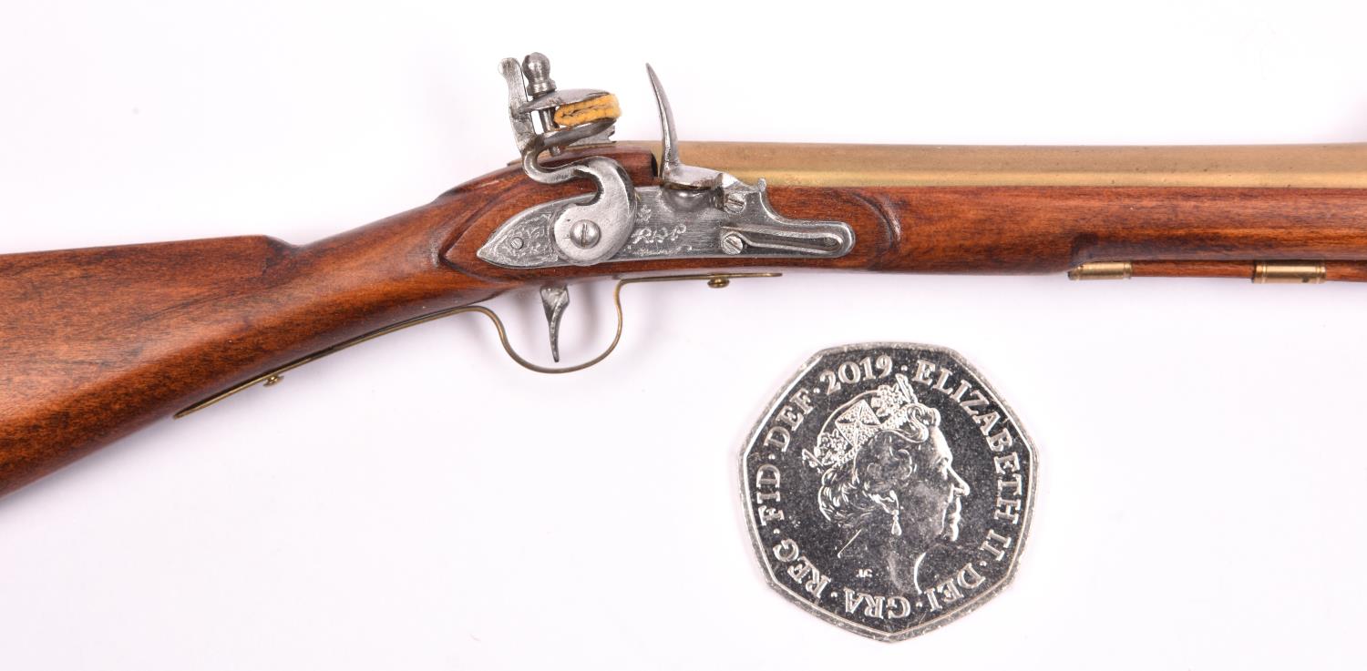 A miniature model of a brass barrelled flintlock blunderbuss with folding bayonet, 6½" overall. - Image 2 of 2