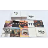 A Beatles CD box set; 'The Beatles in Mono'. In white slip case. VGC, minor wear/damage