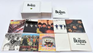 A Beatles CD box set; 'The Beatles in Mono'. In white slip case. VGC, minor wear/damage