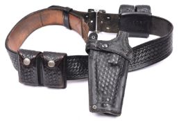 A Tex Shoemaker black leather basket weave belt with Safariland holster, for revolver and twin speed