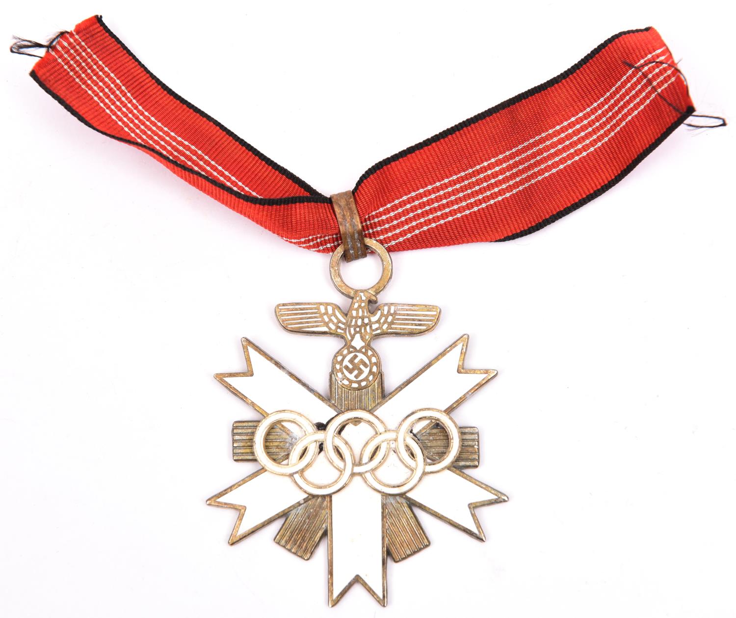 A Third Reich Olympic Games commemorative decoration, 1st class, with ribbon marked on reverse "