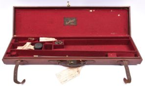 A leather covered case for a sporting gun with 28" barrels, with cloth trade label of Cogswell &