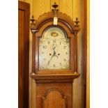 An oak cased longcase clock. Early 19th Century clock striking on a bell with an 8 day movement,