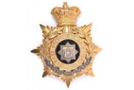 A Victorian Officer's helmet plate of the East Surrey Regiment, gilt silver star badge to centre and