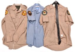 A California State Park Police tooled leather trouser belt; a California State Parks tan shirt;