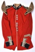 A post 1953 Private's scarlet tunic of the Welsh Guards, anodised buttons, and a pair of Bandsman'