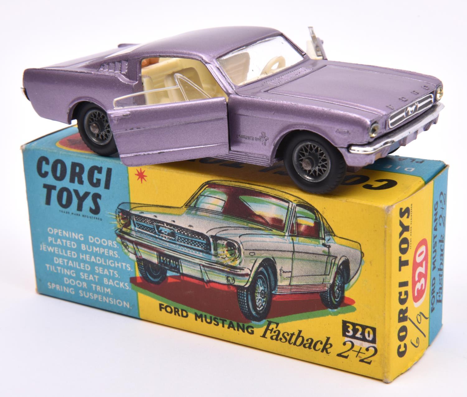 Corgi Toys Ford Mustang Fastback 2+2 (320). An example in metallic lilac with cream interior, fitted