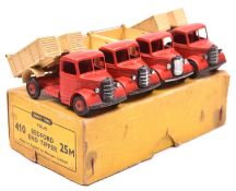 A Dinky Toys 4-vehicle Trade Box (410/25M). Containing 4 Bedford End Tippers. In red with cream body