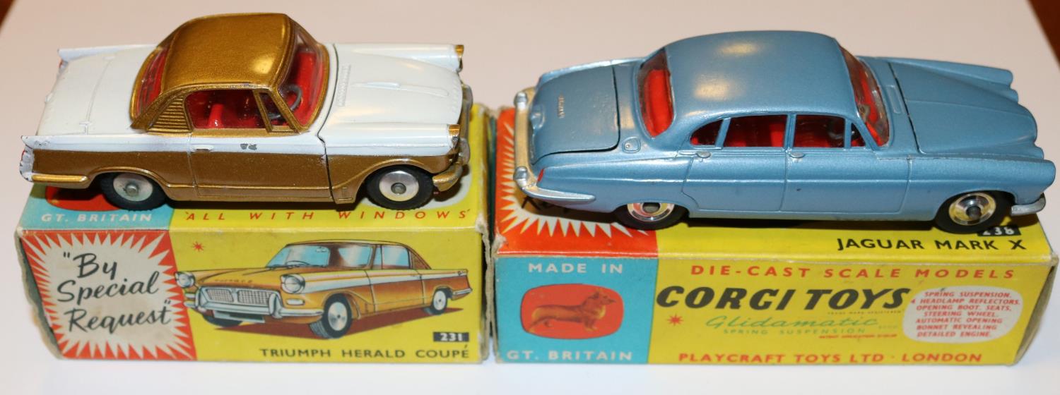 2 Corgi Toys. Jaguar Mark X (238). In light metallic blue with red interior, dished spun wheels with