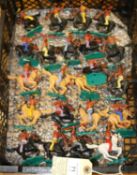 21 Timpo mounted Indians mixed light/ dark brown and also white horses mounted on green plastic