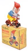 A Morestone Big Ears riding his Bicycle. Red bicycle, Big Ears traditional red, blue and yellow.
