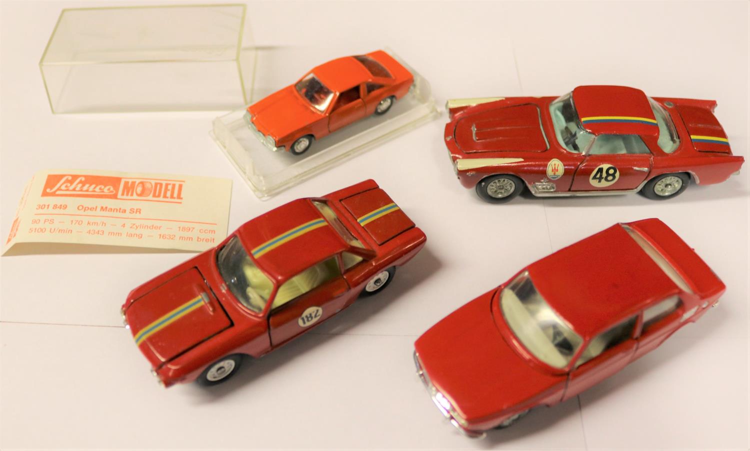 A Tekno Saab 99 finished in red with white interior with silver wheels. Plus a Mercury Maserati 3500