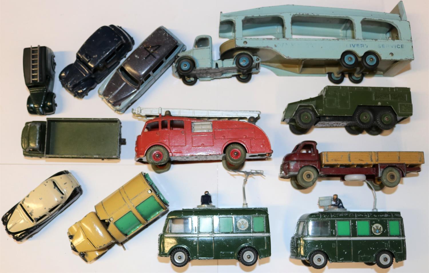 12 Dinky Toys. Including; Bedford Pullmore car transporter. 2x BBC roving eye camera vans. Big
