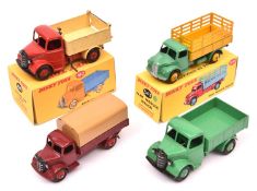 4 Dinky Toys. Bedford End Tipper (410). Red cab and chassis with cream tipping rear body with red