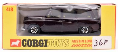 A Corgi Toys Whizzwheels Austin Taxi (418). In very dark maroon, with lemon interior. Boxed, price