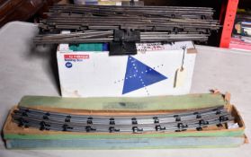 A quantity of Hornby O gauge 3-rail track sections. Including; 2x scarce and early boxes of Hornby